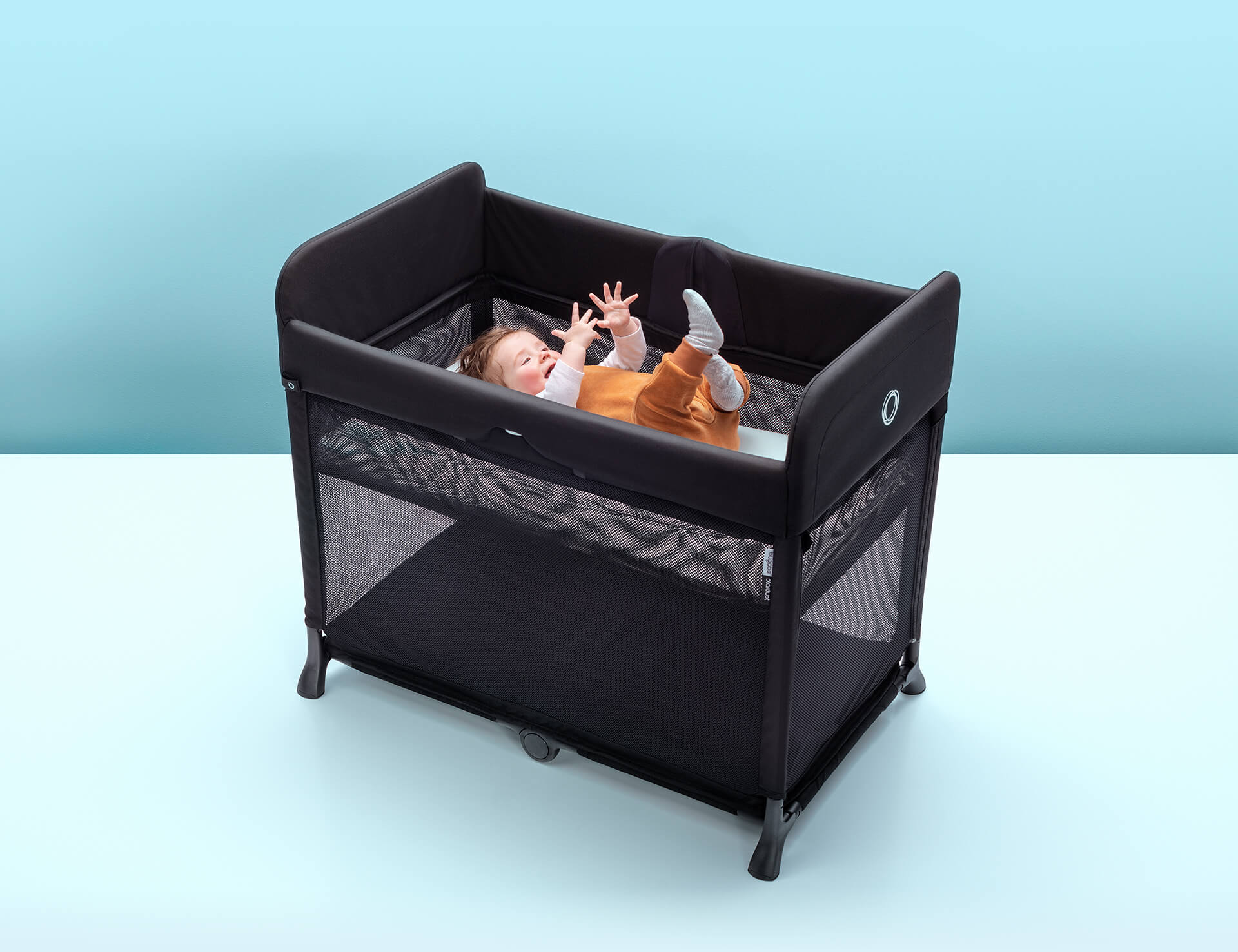 travel cot in living room