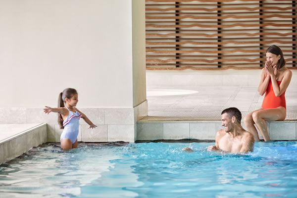 Family in the Indoor Pool - ©The Ritz-Carlton, Toronto