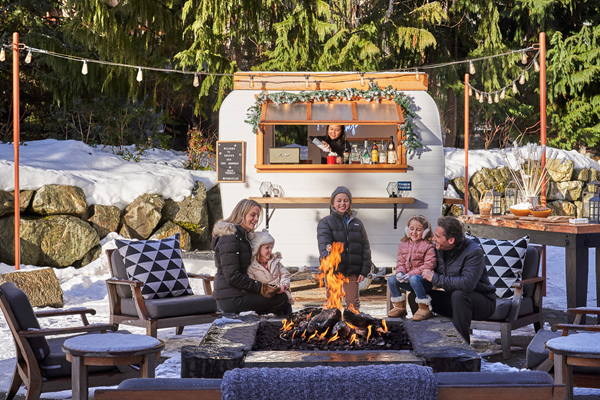 Celebrate the Holidays Four Seasons Style. Enjoy Roasted S’mores and the Signature Hot Chocolate ‘Tipsy Snowman’ near the Vintage Camper at Four Seasons Resort Whistler